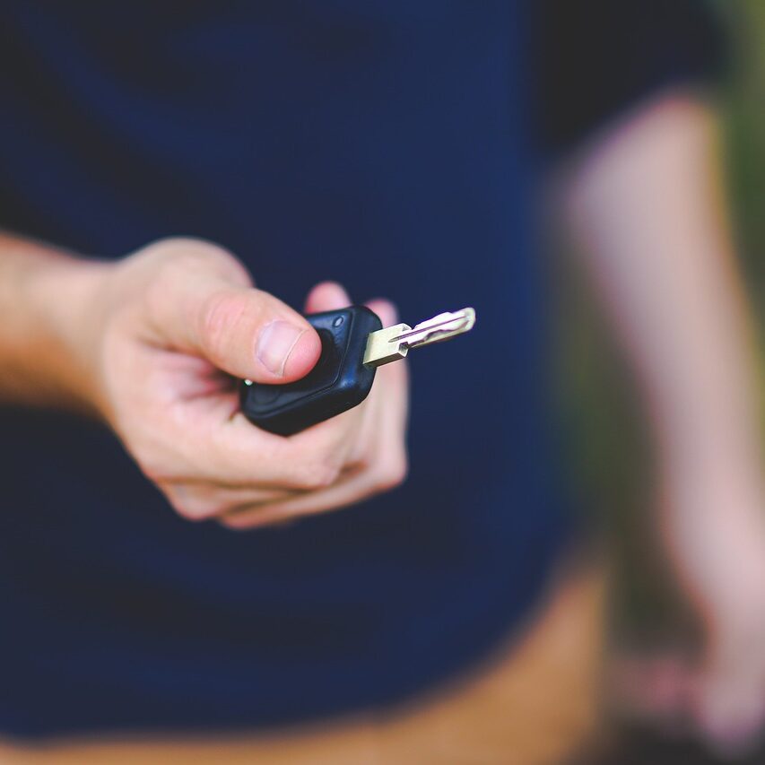 key, car key, hand